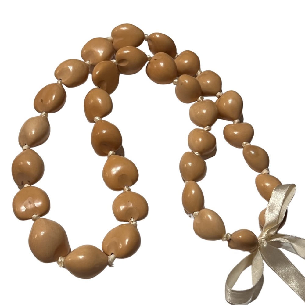 Seed Bead Collection: Large seed strand-knotted and tied with a bow.
